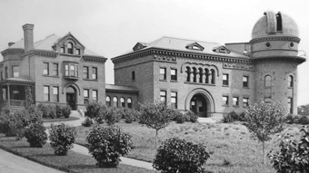 An old black and white photo of a large building.