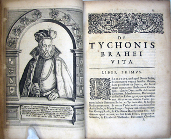 An open book with an image of a man in a robe.