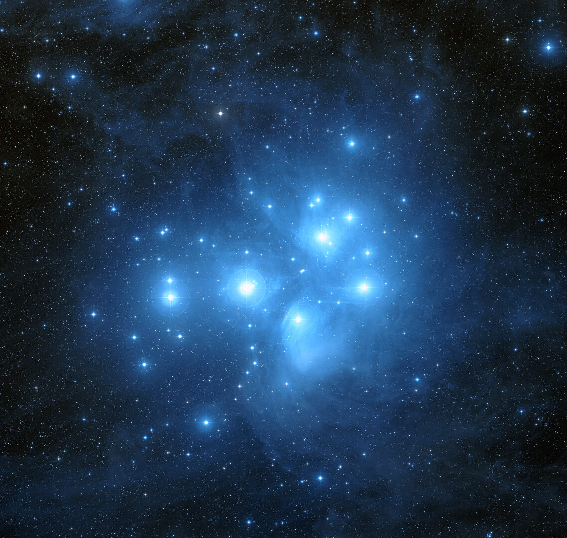 A cluster of blue stars in the sky.