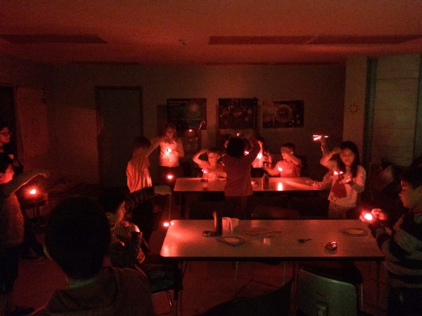 Group of people in a dimly lit room.